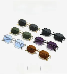 Detailed macro view of vintage polygonal sunglasses with floral engraved metal temples