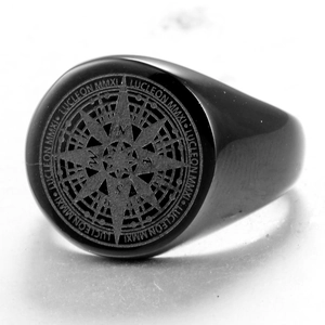 Macro shot of men's black stainless steel ring featuring detailed compass engraving