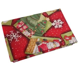 Nordic Christmas tablecloth featuring Santa, trees, and gift patterns on red fabric
