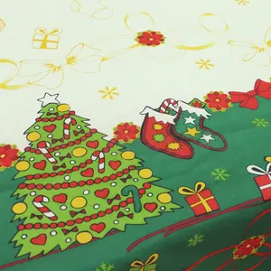 Nordic Christmas tablecloth featuring holiday prints of green trees and festive red stockings