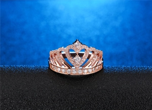 Detailed view of rose gold crown ring with pavé micro-set white cubic zirconia stones
