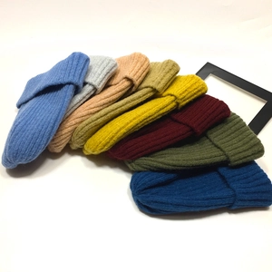 Multiple colors of ribbed knit beanies for men and women in various stylish autumn tones