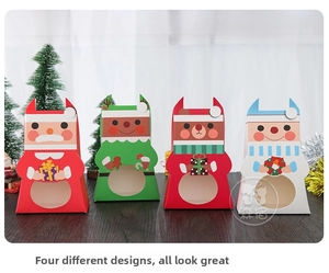 Detailed view of four Christmas gift boxes with transparent windows and festive patterns