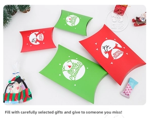 Detailed view of red and green Christmas pillow boxes with reindeer and Merry Christmas text