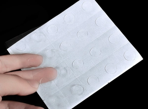 Transparent balloon glue dots detail sheet showing peelable double-sided adhesive dots for decor.