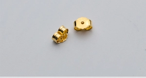 Macro shot of 925 sterling silver earring backs in golden finish for DIY jewelry