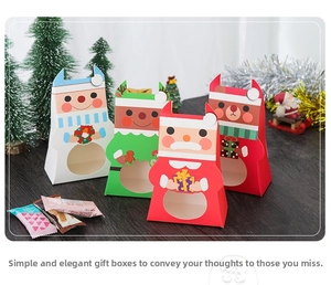 Detail view of colorful Christmas gift boxes with round window and cartoon characters