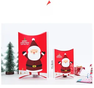 Two sizes of red Santa Claus pillow boxes with Merry Christmas print on white background