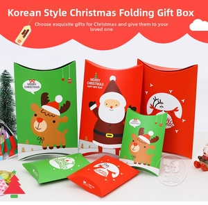 Detailed view of red and green Christmas pillow boxes with Santa and reindeer motifs