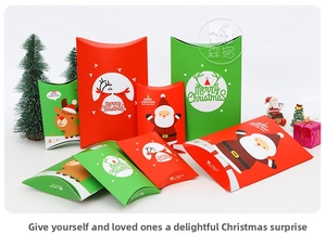 Macro detail of Christmas pillow gift boxes with festive reindeer and Santa Claus designs