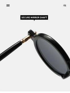 Detail showing the secure golden metal hinge and sturdy shaft of the round sunglasses