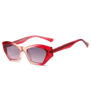 Modern geometric cat-eye sunglasses with red gradient frames and shaded lenses