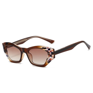 Polygonal tortoise shell sunglasses with gradient brown lenses and artistic texture