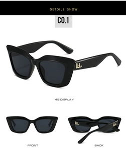 Vue détaillée des lunettes de soleil œil-de-chat noires avec logo doré sur la branche