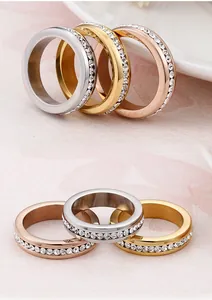 Detailed view of 18K gold plated titanium rings with full pavé cubic zirconia inlay