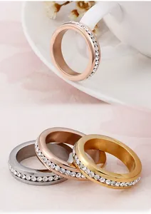 Macro detail of 18K gold plated eternity rings in three colors with full zircon inlay