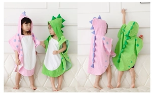 Detailed front and back views of kids cotton hooded towel with dinosaur spikes