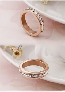 Detailed view of rose gold titanium ring with a full circle of cubic zirconia stones