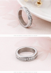 Macro detail of silver titanium steel eternity ring with sparkling cubic zirconia pavé