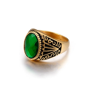 Vintage men's gold ring with green oval gemstone and detailed floral carvings