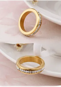 Detail of 18K gold plated titanium ring with a continuous circle of sparkling cubic zirconia