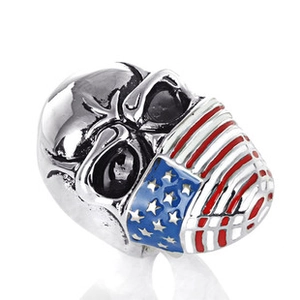 Detail of silver skull ring featuring a vivid American flag face mask in enamel