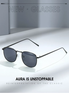 Close-up of retro black metal frame sunglasses on a minimalist white surface