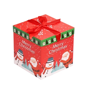 Red Christmas gift box with Merry Christmas lettering and large red satin ribbon bow