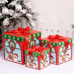 Three-piece red Christmas gift box set with Santa and reindeer patterns and ribbon bows