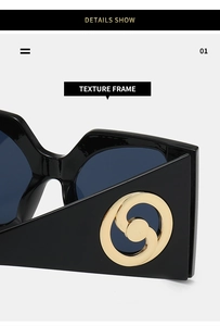 Detail show of texture frame featuring gold metal interlocking rings on black sunglasses