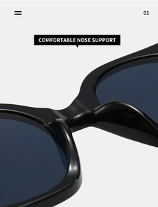 Detail of comfortable integrated nose pads on oversized black polished sunglasses