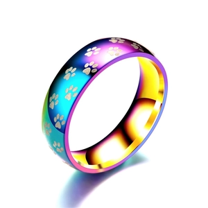 Rainbow gradient titanium steel ring featuring laser-engraved pet paw prints for women