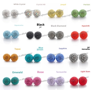 Macro display of sixteen colorful crystal ball stud earrings in a variety of vibrant shades