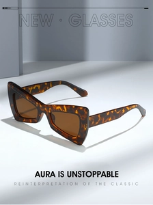 Detail showing high-quality tortoiseshell PC frame with sharp geometric butterfly cut-out