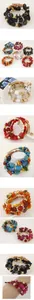 Detail of bohemian multilayer stretch bracelets with turquoise beads and alloy charms