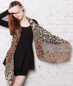 Detail of soft leopard and polka dot print on lightweight chiffon silk scarf shawl