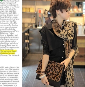 Fashionable leopard print chiffon scarf styled with matching handbag and black blouse