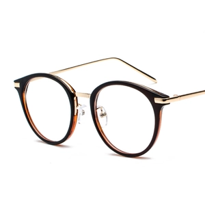 Retro round black and gold frame glasses with metal temples in a 3/4 side view