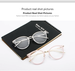 Detailed view of retro round eyewear frames with silver and gold metal temples