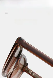 Detailed close-up showing the durable hinge and amber translucent frame of the sunglasses