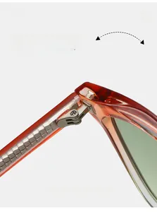 Detail view of durable metal hinges and amber TR90 frame of luxury square sunglasses