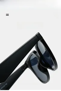 Detailed close-up of sunglasses hinges and 54-22-145 size specs on black temples