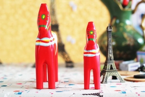 Detail of red hand-painted Swedish Dala horses with traditional Nordic floral patterns
