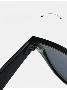 Macro detail of a durable metallic hinge on polished black olive green sunglasses