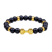 Detailed view of matte black beaded bracelet with gold dumbbell charm and textured spacers