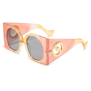Oversized retro green sunglasses with gradient frames and gold circular metal details