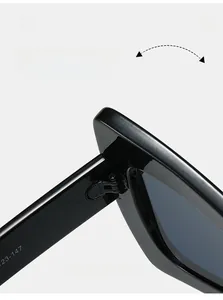 Detail shot of durable reinforced metal hinge on glossy black butterfly sunglasses