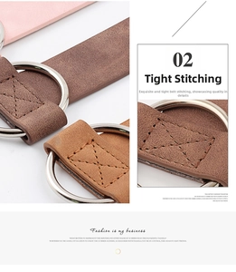 Close-up of brown leather belt showing metal D-ring buckle and reinforced X-stitching