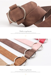 Detail of vintage matte leather belts with round silver buckles in multiple colors