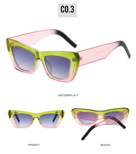Détail de lunettes de soleil œil de chat avec monture dégradée vert-rose et verres violets